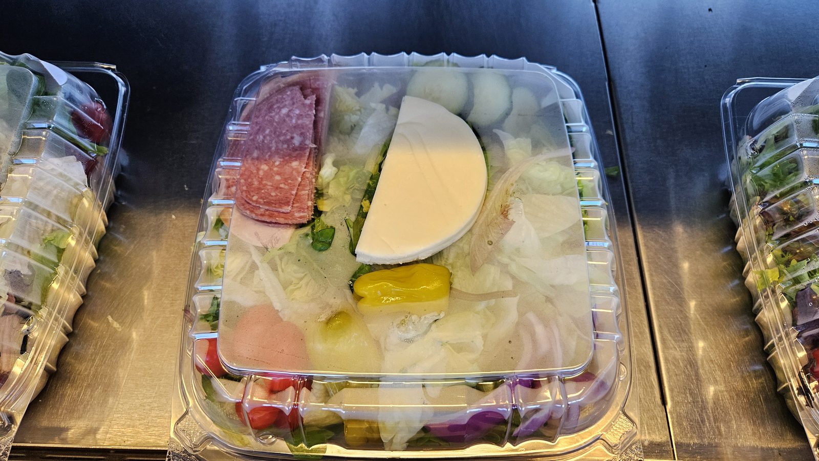 Fresh packaged salads in the cooler