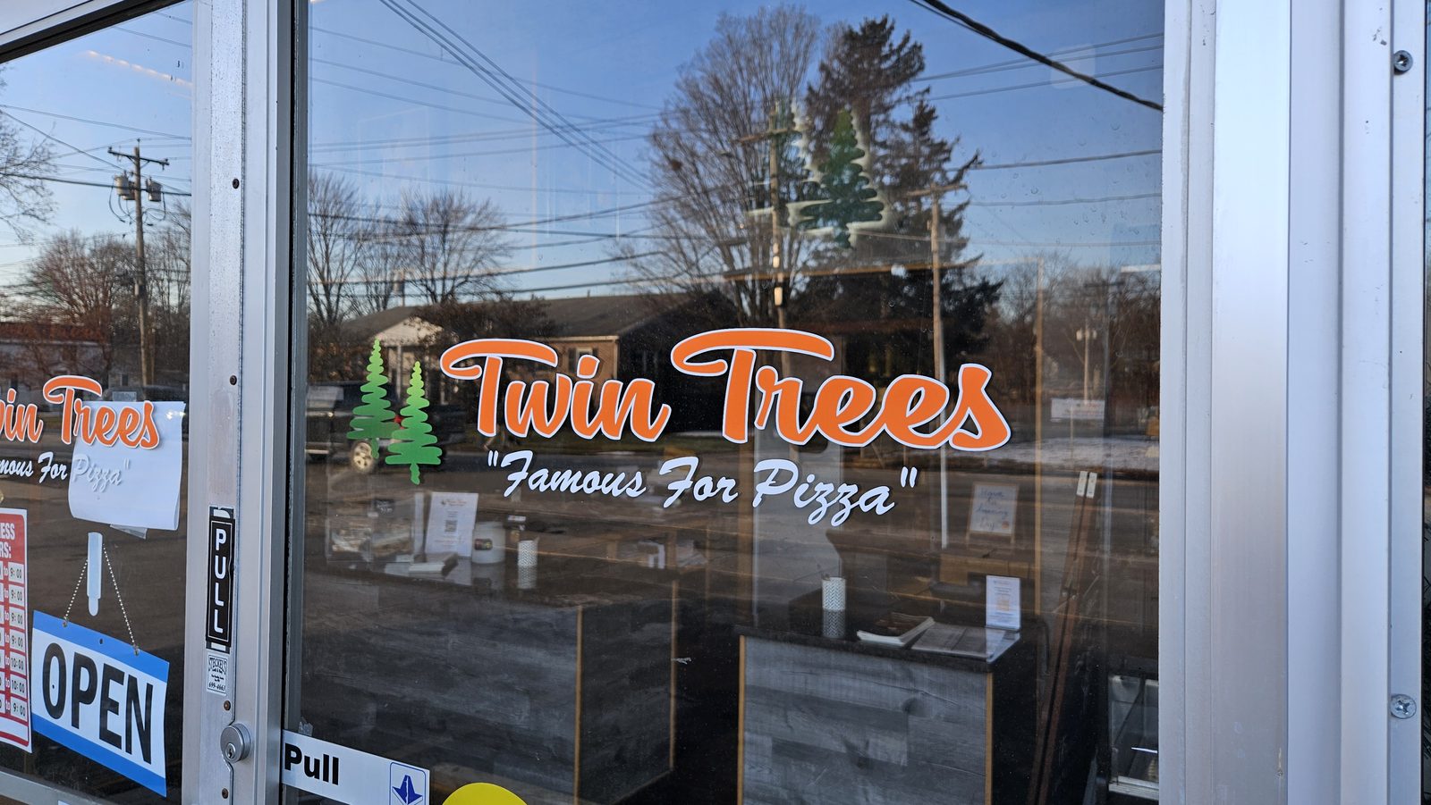 Twin Trees Famous For Pizza window sign